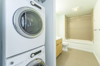 Stacked washer dryer in unit